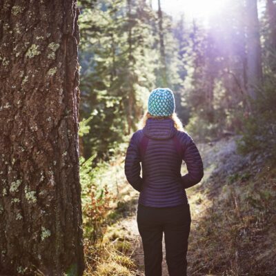 woman walking in a forest